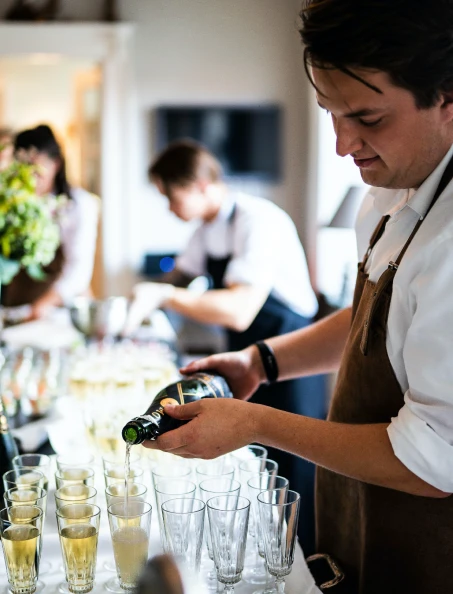 bartender pouring drinks at private house party in Perth